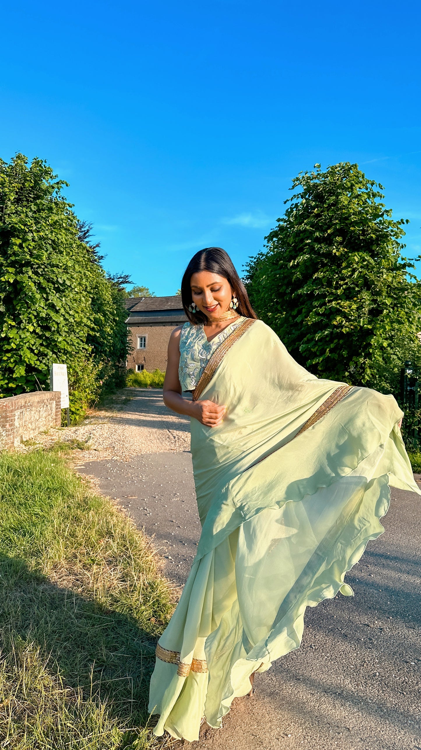 Ruffled Chiffon Saree and Exquisite Silk Blouse with Collar Embellishments